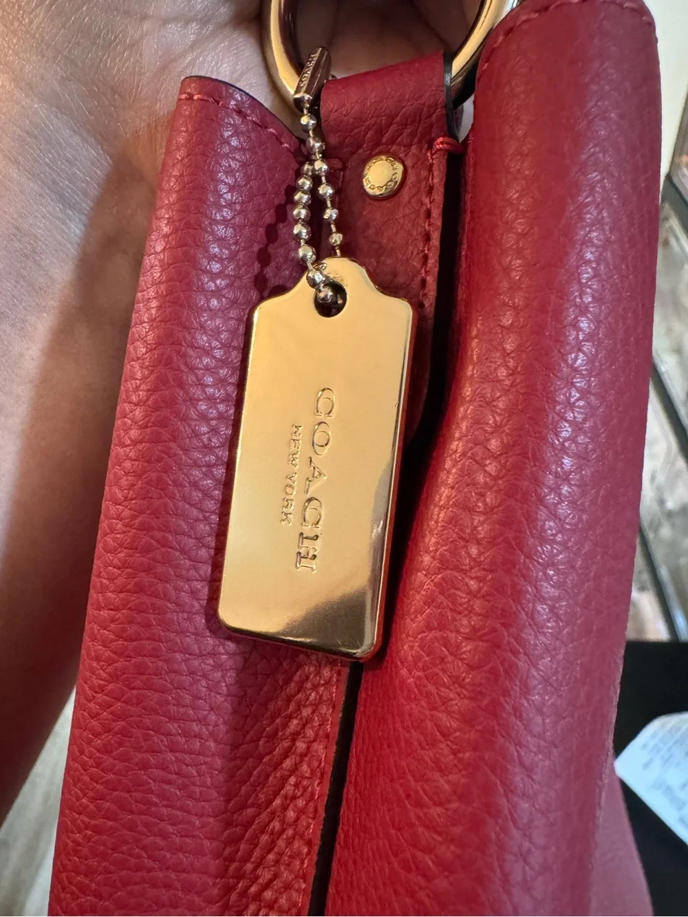 Coach Red Pebbled Leather Shoulder Tote with Gold Hardware Strap not included.